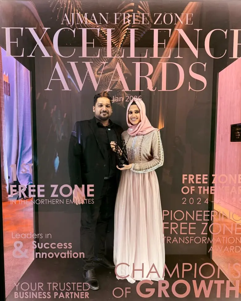 Kinzaad founders holding the Emerging Partner of the Year award at the Ajman Free Zone Excellence Awards 2026